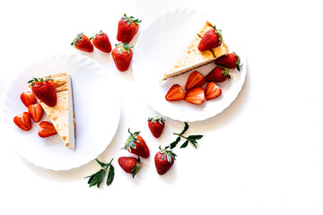Home-baked cheesecake on white plate topped with whole organic home grown strawberries background with copy space. Self-sustainability concept. Healthy diet. Clean eating. Father's day Summer is now. 