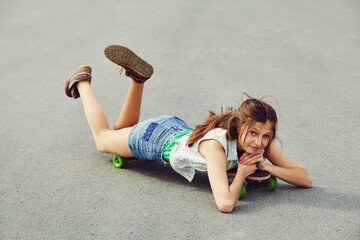 Portrait of a young woman with a longboard. trendy casual hipster teenage girl with a skateboard.