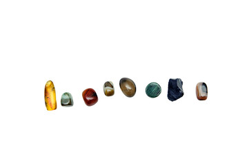 various semiprecious stones on a white background, from above, isolate