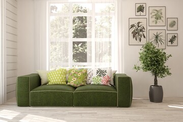 White stylish minimalist room with green sofa and summer landscape in window. Scandinavian interior design. 3D illustration