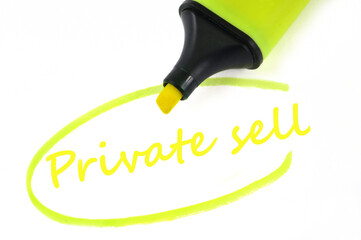 Private sell written in neon felt in close-up on white background