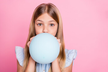 Portrait of cute adorable kid girl prepare mother anniversary party inflate air ball balloon wear...