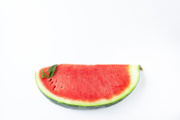 Sliced of fresh red ripe watermelon with mint on white background