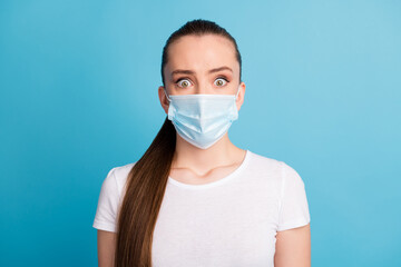 Closeup photo of scared pretty lady keep social distance people came hospital examination see crowd wear protect face medical mask white t-shirt isolated blue color background