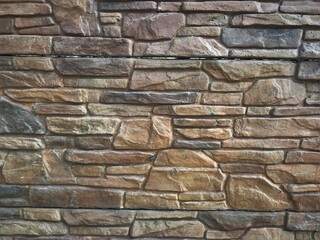 background texture from sections of concrete fence private house stylized as natural stone