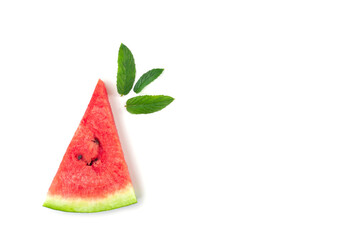 Slice of watermelon with seeds and mint leaves isolated on white background.