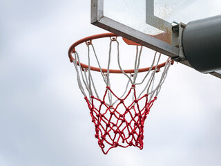 Basketball ring with a net for playing basketball outdoors