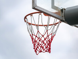 Naklejka premium Basketball ring with a net for playing basketball outdoors