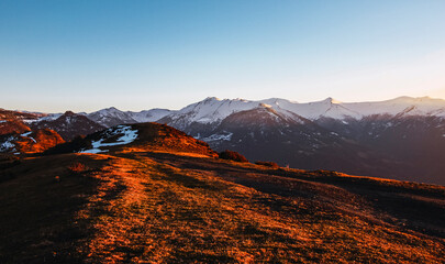 Landscape of snowy mountains during the sunset at the north of Spain