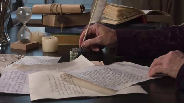 Writer Rereads and Appends the Manuscript. Medieval writer rereads text on a sheet of old paper and appends with a pen at the bottom a few lines