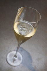 A glass of bubbly sparkling wine that could be champagne, proseco or method cap classique.