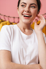 Photo of young cheerful woman laughing and posing at camera