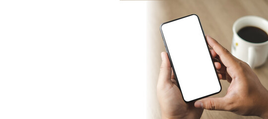 Top view Mockup image hand using a smartphone man Holding Cell Phone With Blank Screen