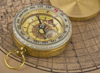 Compass on old paper as a background.