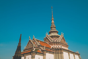 Fototapeta na wymiar A large temple at Wat Phra Kaew next to the Grand Palace in Bangkok, Thailand