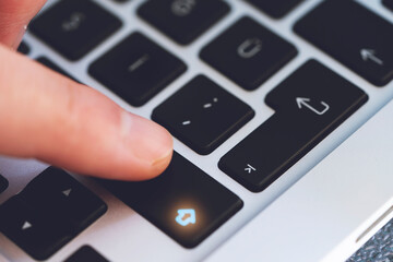 Closeup of Man's Finger Touching the Letter Shift Key button on Black Computer Keyboard