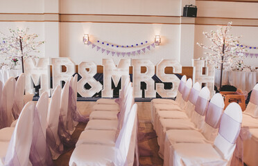 wedding chairs and mr and mrs sign
