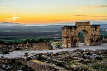 Volubilis is a partly excavated Berber city in Morocco situated near the city of Meknes, and commonly considered as the ancient capital of the kingdom of Mauretania.