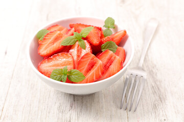 fresh strawberry in bowl with mint leaf