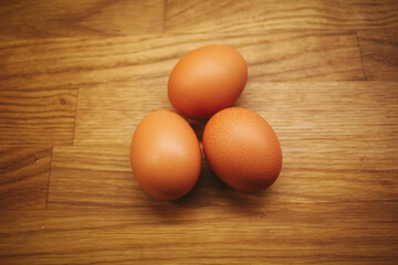 Eggs on wooden table.