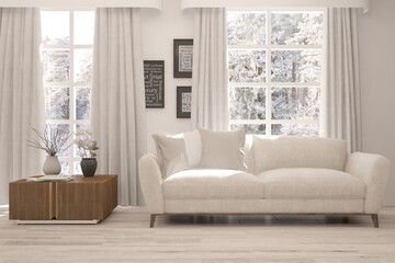 Fototapeta premium White stylish minimalist room with sofa and winter landscape in window. Scandinavian interior design. 3D illustration