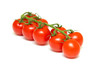 Fresh red cherry tomatoes isolated on white background.