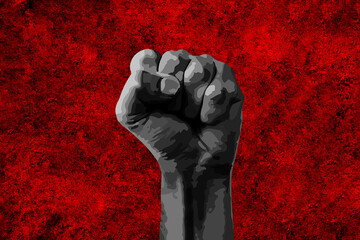 Black fist raised with a powerful anti-racist message calling for freedom and equality