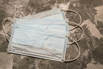 Surgical mask with rubber ear straps. Typical 3-ply surgical mask to cover the mouth and nose....
