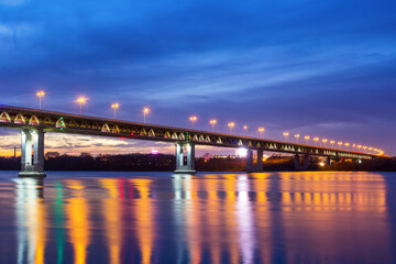 Fototapeta na wymiar Multi-colored lighting of the metro bridge in Nizhny Novgorod