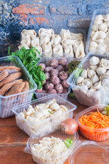 Frozen food pelmeni, manti, pierogi, ravioli and meatballs.