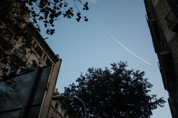 The plane and its footprint in the blue sky. 