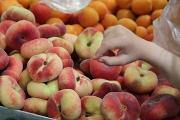 Child hand picking market fruits