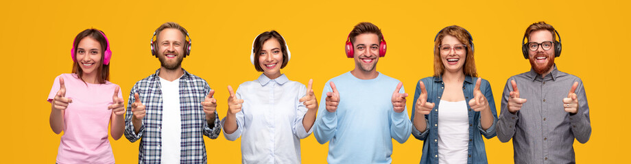 Cheerful modern people listening to music