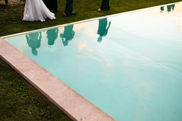 Reflection of people in the pool.