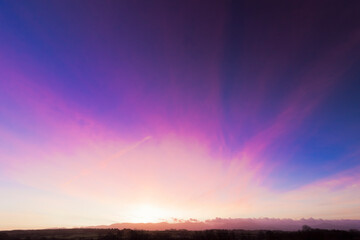 Beautiful sunrise skyscape behind the Snowdonia Mountain Range, North Wales