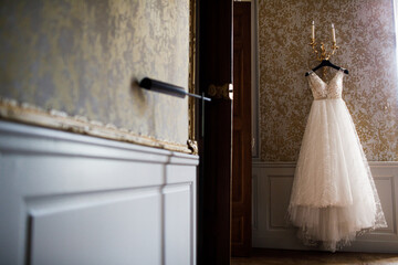 bride's wedding dress on a mannequin. Near the window.