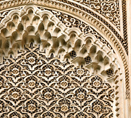 detail of islamic architecture of stone fretwork on palace wall in Morocco 