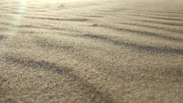 Cave storm in the desert. Sand waving in the wind in dunes in desert. Sand dunes Arabian desert. Sand dunes wave pattern. 
