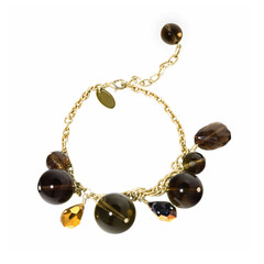 Women`s wrist bracelet of golden chain, gem stones and beads