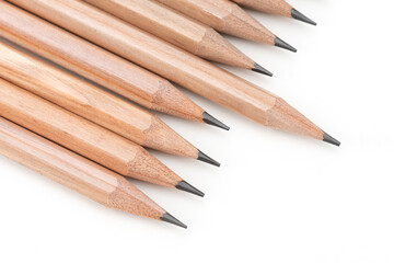 Obraz premium Close-up wooden pencils on the white background.