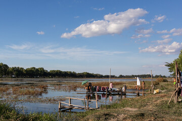 Nyaungshwe, Myanmar, November 2019: Daily life of kids playing at Tharzi pond next to Inle lake,...