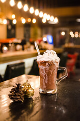 Freshly made brown hot chocolate with whipped cream