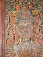 view of Giant goddess guarding wood carving on the door of buddhist temple, Wat Chet Yot or officially called Wat Photharam Maha Wihan in Chiang Mai City, northern of Thailand.