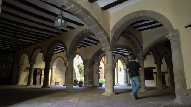 tourist taking photos with the cell phone inside the Mora de Rubielos town hall in Teruel
