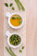 Green cones in yellow syrup