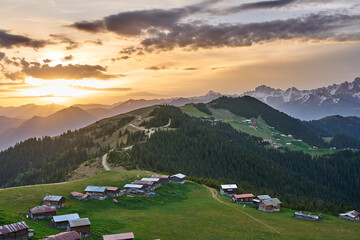 Sunrise landscape of Pokut and Sal Plateaus, with snowy mountains, clouds and green nature, Kackar Mountains, Rize, Black Sea / Karadeniz region of Turkey