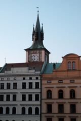 Fototapeta na wymiar Old Prague clock tower. Picturesque European houses.