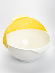 white and yellow colander for kitchen