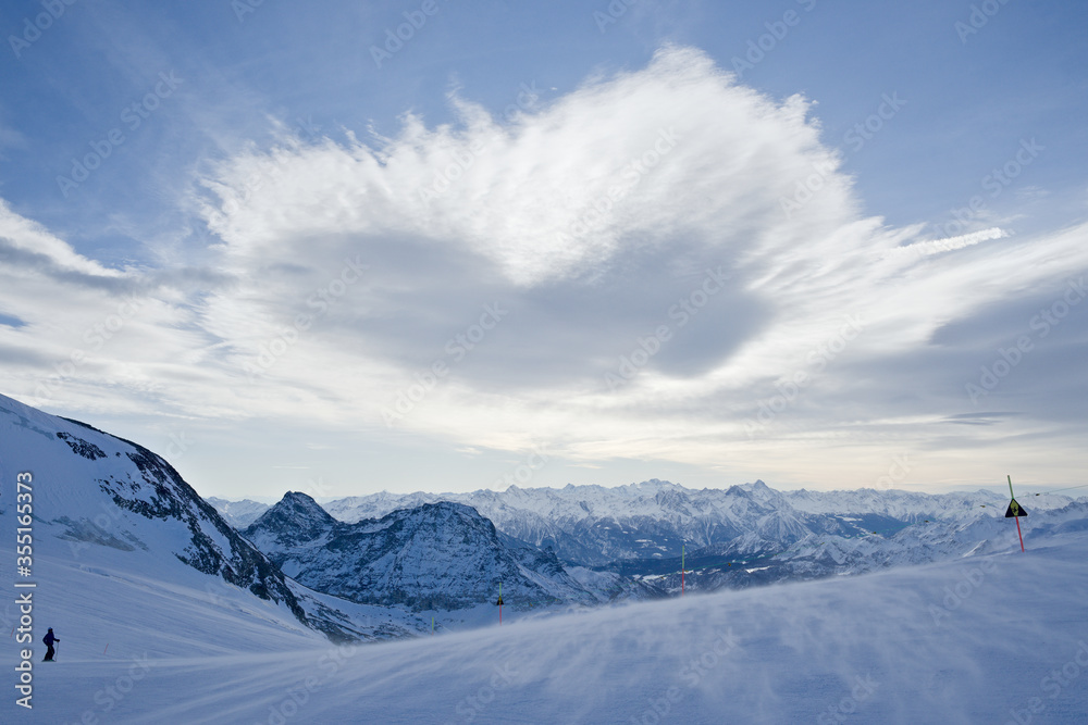 Wall mural blue mountain view with ice and snow