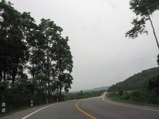 Black road with beautiful nature